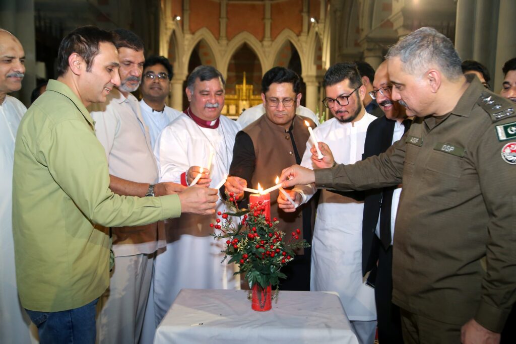 Mr. Mohammed Ali Butt (DSP, CCD), Brig. Noor Mahi Gujjar, Rt. Rev. Nadeem Kamran (Bishop of Lahore), Mr. Imran Kishwar (D.I.G Admin., Lahore), Ch. Ghulam Mujtaba Murala (C.E.O, Jarida Today), Mr. Abdur Rehman Ranjha (Vice-president, Lahore High Court Bar Association) and Mr. Asif Ataa (DSP, Barki) lighting the candle of peace at the Cathedral Church of Resurrection, Lahore
